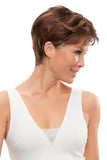 Woman with hair fall is wearing a short layered brunette Annette wig 