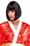 Woman dressing up wearing a Chic Doll wig with a chin-length bob and blunt-cut bangs 