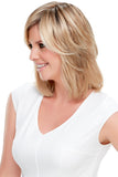 Woman with fine hair wearing the Essentially You Hair Topper with a translucent monofilament base