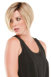 Woman with progressive hair loss showing the blonde sleek heat friendly synthetic Ignite wig