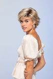 Lady with progressive hair loss wearing her light blonde Jazz wig with dark roots 