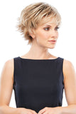 Lady with hair fall wearing the short style Jazz wig with flipped out layers 