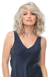 Female with advanced hair loss in the Julianne synthetic wig with effortless beach waves 