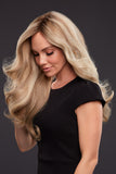 Woman with hair loss showing her Kim wig with extra long layers 