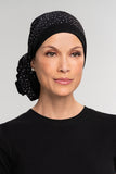 Front view of the black Reversible Softie Wrap worn by a woman with alopecia