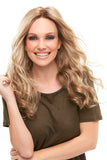 Happy woman with progressive hair loss wearing the synthetic long wavy Sarah wig 