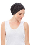 Lady with hair loss wearing an ultra soft  black Softie 