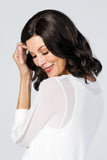 Happy woman with fine hair wearing the Top Coverage 12 inch wavy topper by Jon Renau 