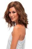 Model with thinning hair is wearing a wavy Top Wave 12 Inch Hair Topper from Fascinations 