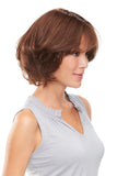 Woman with fine hair is adding volume by wearing her Easipart French hair topper by Jon Renau 