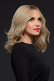 Female with thinning hair wearing a light blonde Gwyneth wig with a lace front 