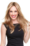Smiling woman with hair loss is wearing her long layered Alessandra wig 