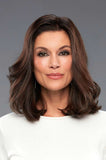 Woman with brown clip in hair extension that measure 12 inches long by 6 inches wide