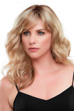Young model with hair loss is wearing a wavy light blonde wig called Alexis 