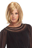Woman with thinning hair is wearing a blonde synthetic Alia Petite wig