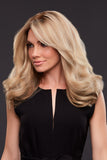 Model with fine hair is wearing a hand tied human hair wig in a blonde shade in the style Angie 
