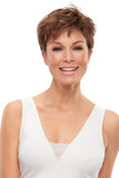 Happy woman with Alopecia Areata is covering her head in a sophisticated Annette wig