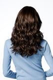 Female showing the back of her synthetic wavy Bryce wig with a lace front 