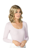 Young woman with thinning hair wearing a blonde Caelen wig in the Nouveau range