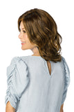 Lady with balding showing the back of her shoulder length synthetic Caelen wig 