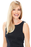 Smiling woman with fine hair covering her head with a Camilla hand tied wig 