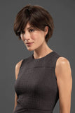 Female with thinning hair wearing a short style wig tapered just below the nape in the style Capri