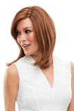 Model with hair loss covering her head with her brunette human hair Cara wig 