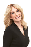 Happy woman with Alopecia wearing the Cara Human hair wig with a French drawn top 