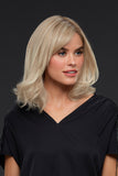 Woman with Balding wearing her Carrie Petite wig in the shade Palm Springs Blonde 