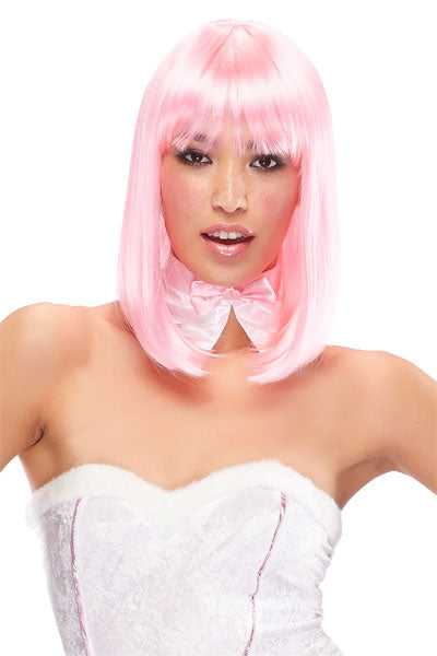 Woman at dress up party wearing a long bob style China doll wig in the colour pink 