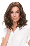 Model showing her brunette shoulder length Clair wig with a single monofilament top 