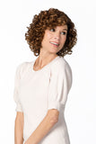Model with fine hair is showing her brunette synthetic curly Alanna wig 