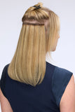 Young woman adding volume and fullness to her blonde fine hair wearing Easipieces Clip in extensions
