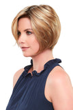 Woman with thinning hair covering her head with the Elisha Petite synthetic wig in shade 14/59S10