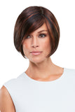 Female with fine hair is showing her brunette synthetic Elisha Hand Tied Wig by Jon Renau 