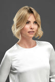 Woman with hair loss wearing the Euro Easipart French Knotted 8 Inch Hair Topper by Jon Renau 