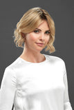 Female with balding showing the Euro Easipart French Knotted 8 Inch Hair Topper in a blonde shade 