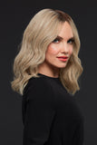 Smiling woman with hair loss wearing the hand-tied Gwyneth wig 