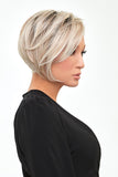 Model with balding wearing a light blonde Ignite wig from Fascinations 