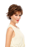 Woman with advanced hair loss wearing a short brunette synthetic Jazz Petite wig from Jon Renau 