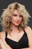 Woman with progressive hair loss wearing the long length Jennifer wig in a blonde shade 