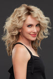 Happy woman with hair loss wearing the long layered Jennifer human hair wig 