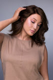 Female with progressive hair loss is wearing the Carrie Petite Lite wig with ear to ear lace 