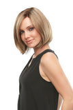 Young woman with progressive hair loss showing the blonde Kristi wig by Jon Renau 