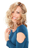 Smiling woman with thinning hair wearing her Mila Petite Wavy Synthetic Wig
