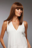 Model with thinning hair wearing her sleek brunette Sienna wig with bangs 