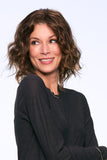 Happy woman with progressive hair loss wearing a brunette bob style wavy Julianne Lite wig 