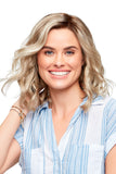 Smiling woman with Alopecia wearing a blonde shoulder length wavy Julianne Lace Front Wig 