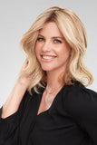 Smiling woman with advanced hair loss wearing the 18 inch Juliette Remy Human hair bondable topper
