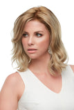 Lady with thinning hair wearing a wavy synthetic blonde Kendall wig from Fascinations Cape Tow